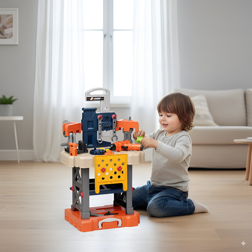 A young boy kneeling at the Kids Tools Trolley opened into a workbench, turning the toy drill